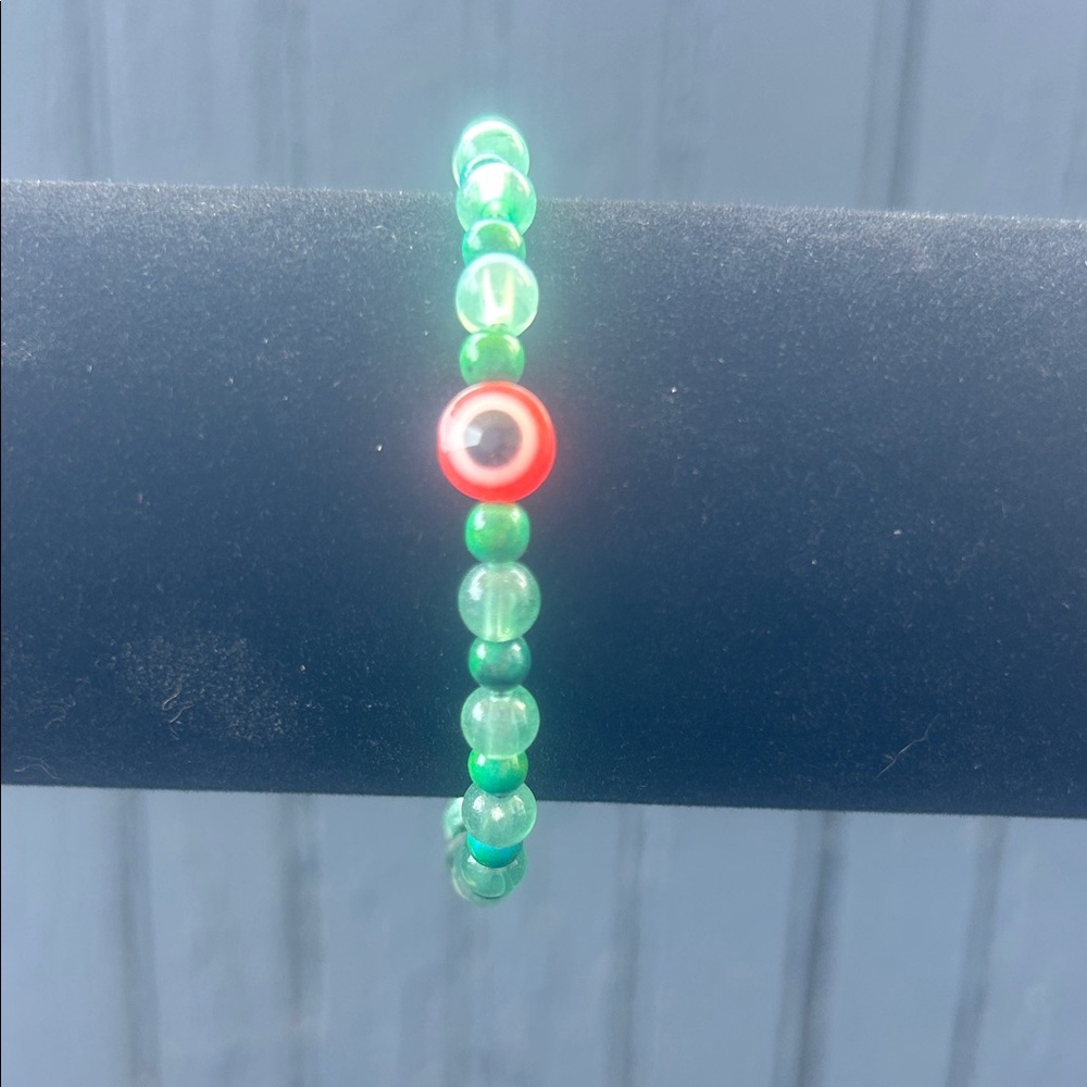 Green Beaded Bracelet with Red Accent